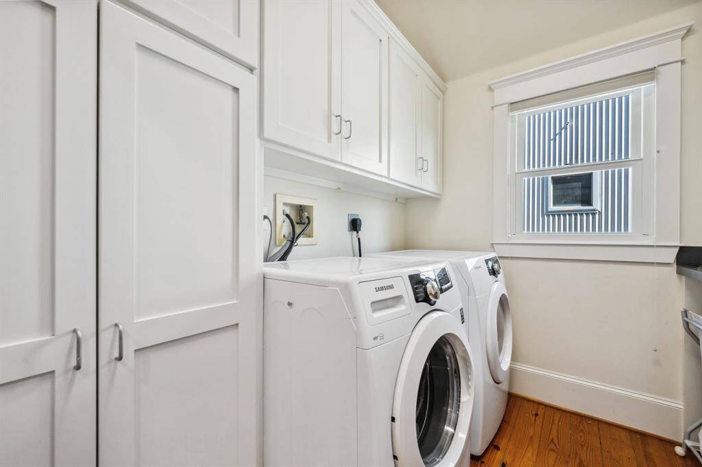 Conveniently located upstairs near the bedrooms, the utility room offers ample storage and a folding counter.