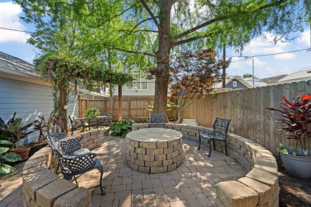 Another view of the fire pit and backyard.