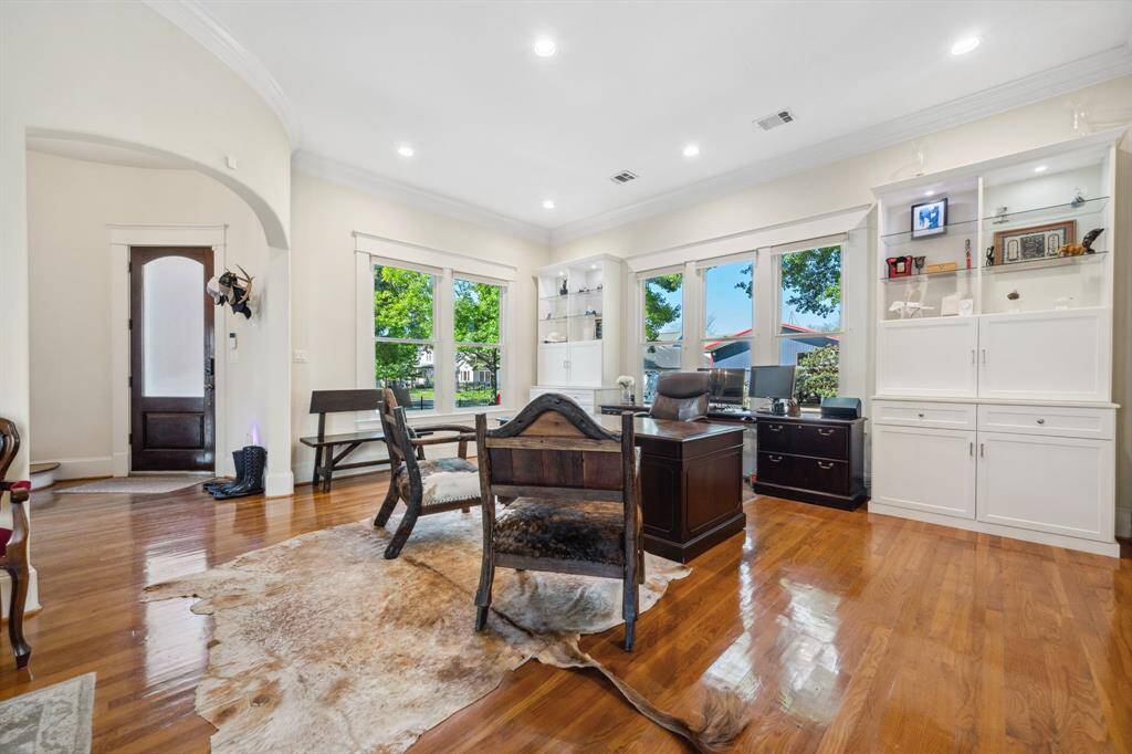 Versatile formal living room currently utilized as a home office—ideal for entertaining or creating a welcoming space for guests