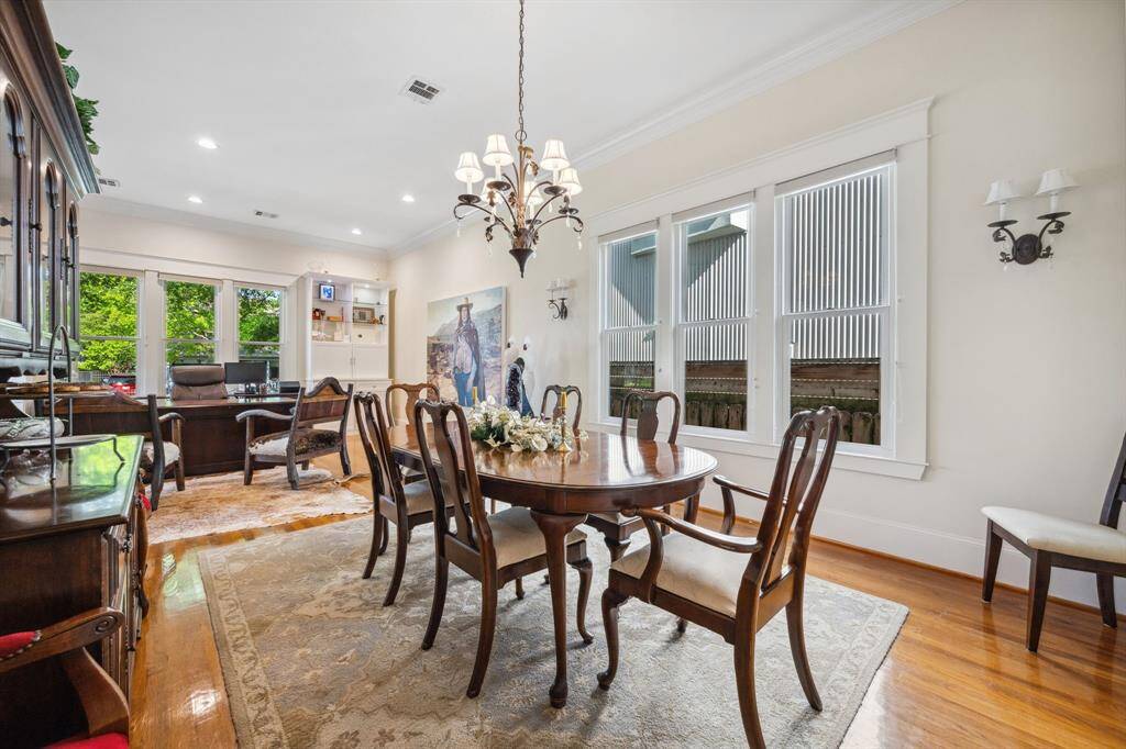 The formal dining room sits adjacent to the formal living room, offering a seamless flow that’s perfect for entertaining.