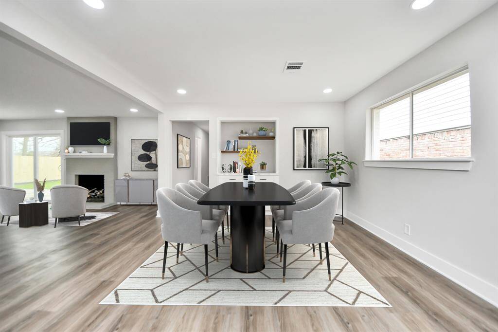 The dining space incorporates a stylish butler's pantry with cabinetry for storage. This space has been virtually staged.