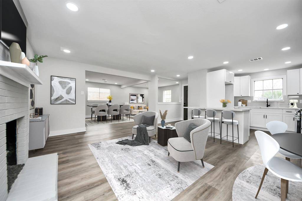 A view of your open floor plan with plenty of space to entertain and host family. This space has been virtually staged.