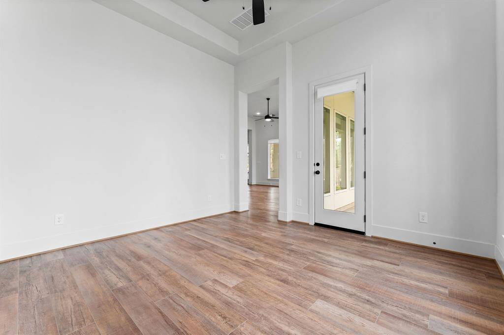 Here's another view of the Sunroom showcasing its connection to the covered porch and the backyard. Whether you envision it as a sunroom, a second office, or a first floor Game or Media room, this space has endless possibilities.