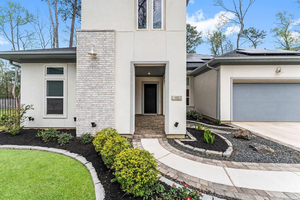 From the moment you arrive, this custom-built home impresses with curated upgrades and luxurious details at every turn. A charming covered front porch with classic brick pavers sets the tone, leading to a grand wood entry door that makes a statement all its own. Truly exceptional craftsmanship—inside and out.