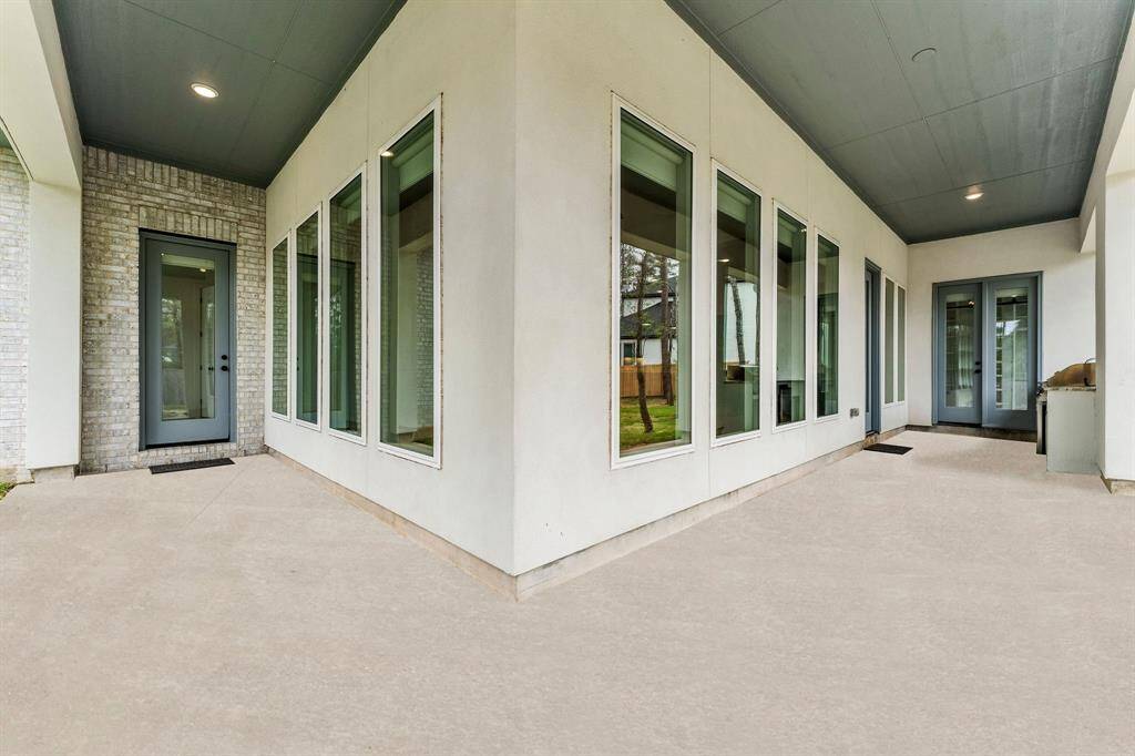 This inviting covered patio, complete with recessed lighting, creates the perfect shaded retreat for relaxing and enjoying the views. The L-shaped design offers two distinct areas: one off the main living space featuring an outdoor kitchen for easy entertaining, and a more private section off the Owner’s suite and Sunroom for peaceful moments of solitude. With access from the Breakfast area, Sunroom, and Study, this patio seamlessly connects indoor and outdoor living.