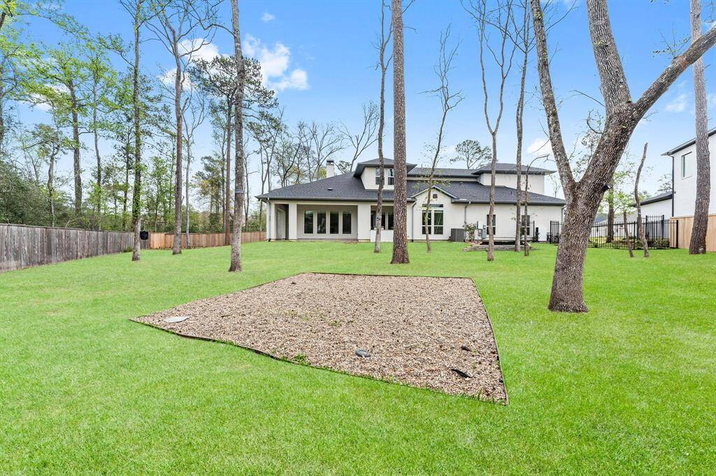 The backyard offers endless potential, featuring multiple entertaining spaces and areas perfect for play! Whether you're hosting a gathering, enjoying a quiet afternoon, or watching the kids run around, this versatile space is ready to be customized for all your outdoor activities and gatherings.
