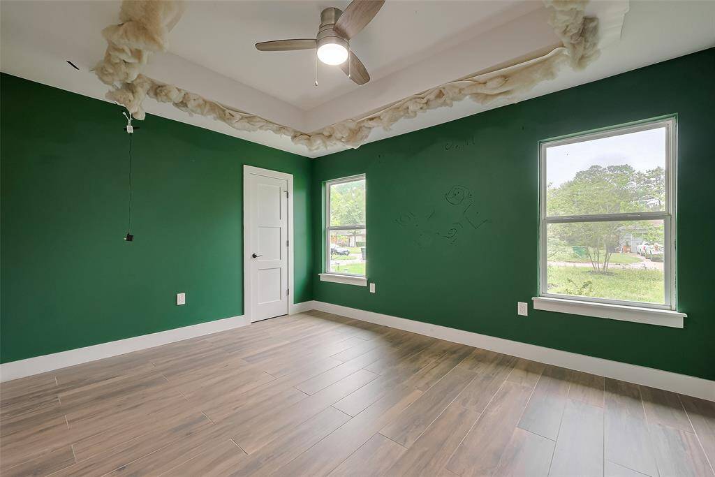 Charming secondary bedroom featuring unique cloud-themed ceiling details- Removal upon request.