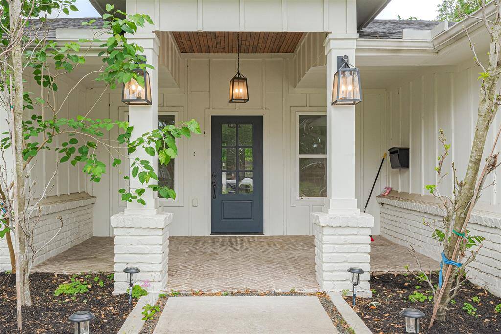 Welcoming front exterior with a cozy patio area, perfect for relaxing and enjoying the outdoors.
