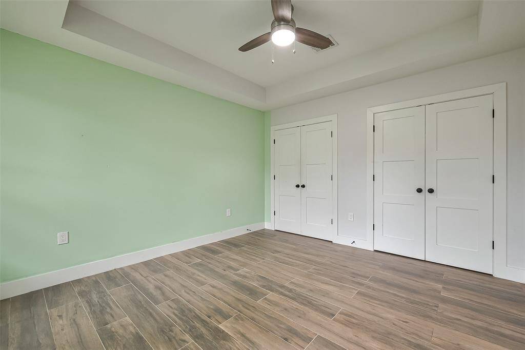 Versatile secondary room, perfect for a home office, bedroom, or personal space.