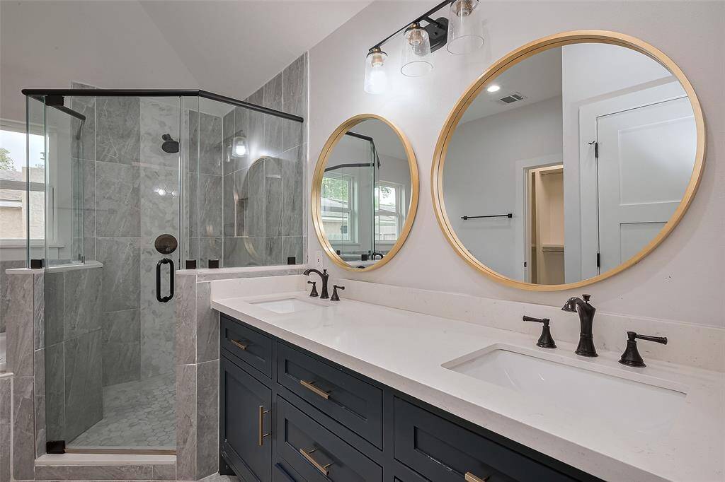 Primary bath with double sinks, offering plenty of space and convenience.