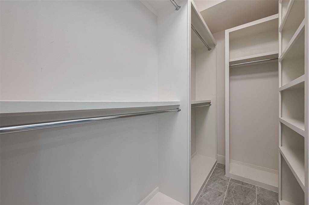 Expansive walk-in closet in the primary bedroom, designed for maximum storage and organization.