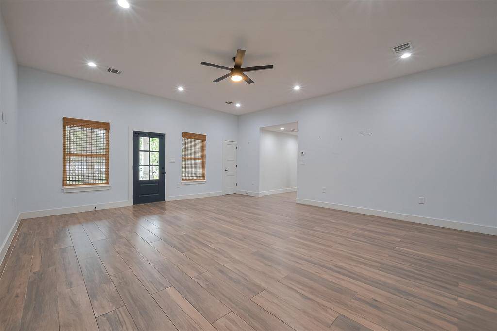Spacious open-concept living room with seamless flow, perfect for modern living and entertaining.