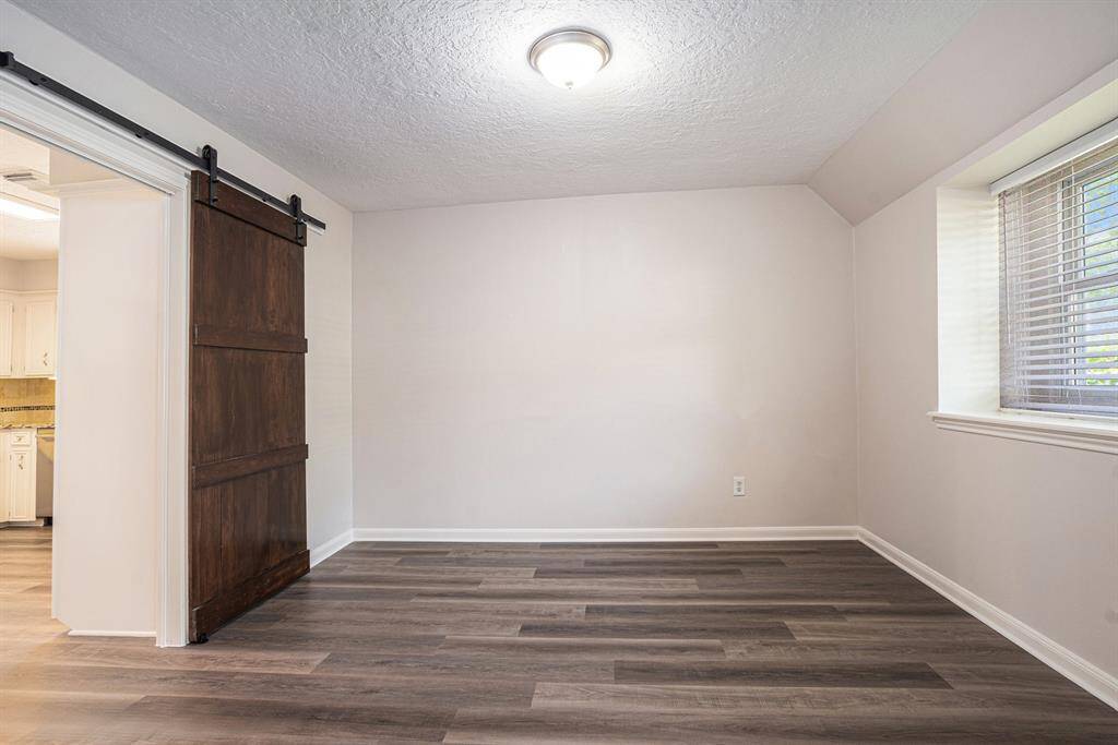 Formal dining room with sliding barn door