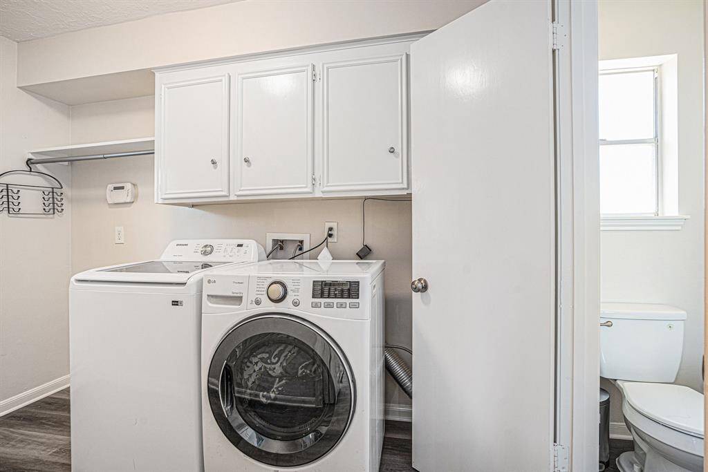 Downstairs laundry room with half bath