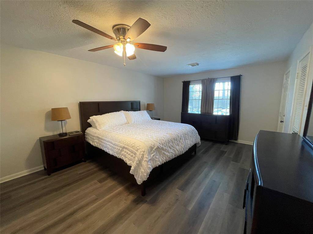 Downstairs primary bedroom has door opens to pool