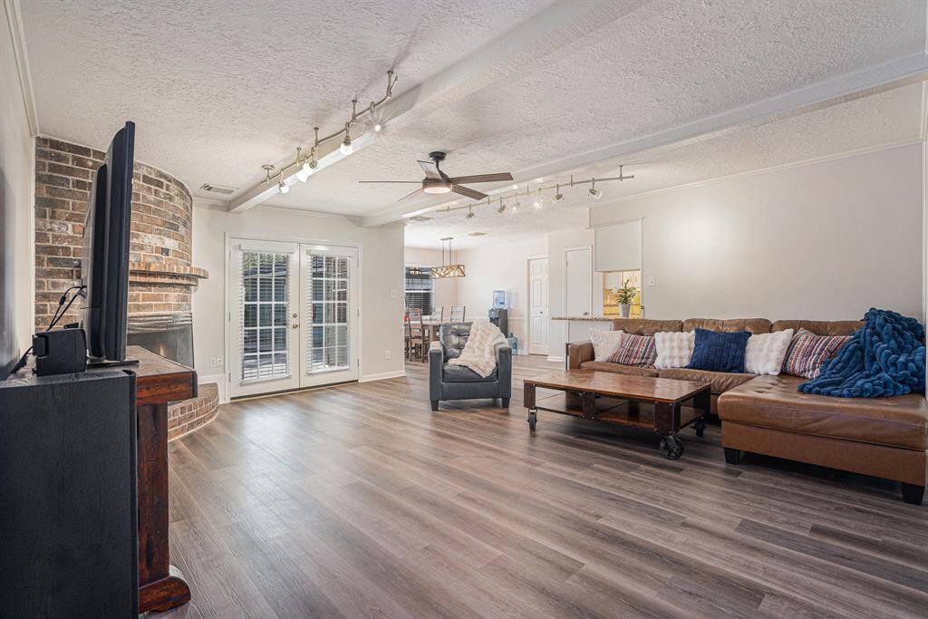 Family room with double doors to backyard & pool
