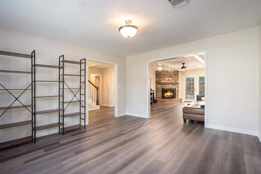 Formal living room opens to family room & formal dining