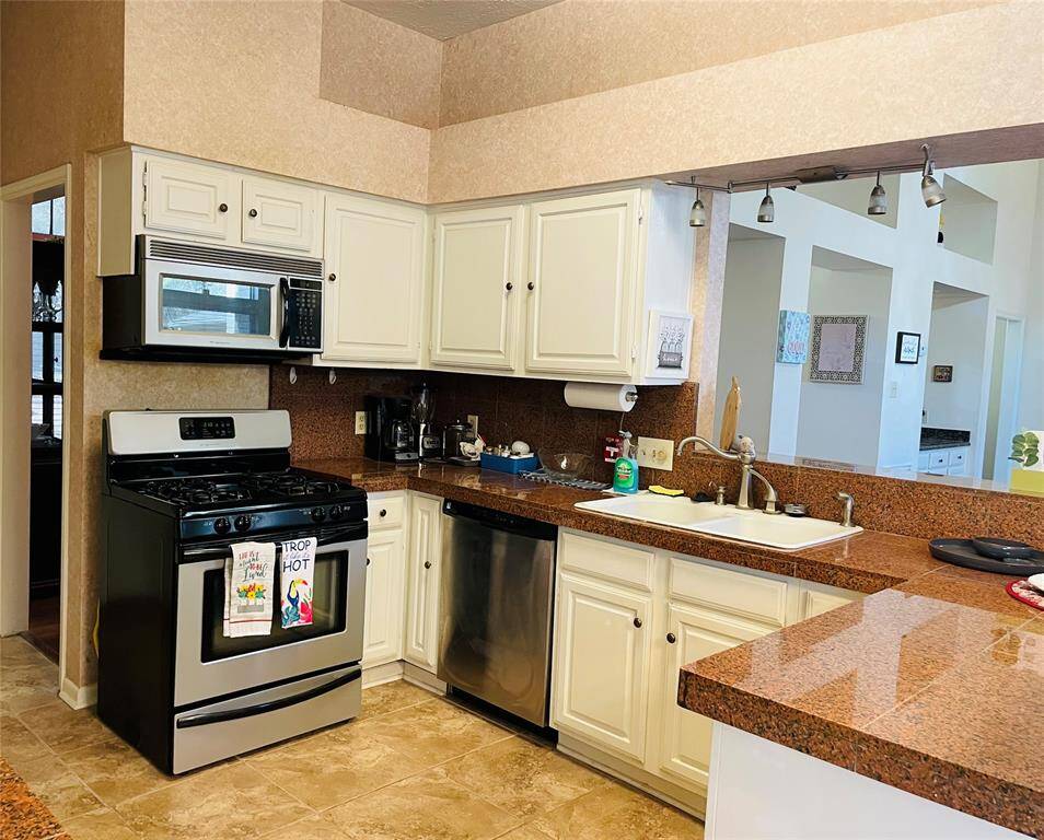 Granite countertops for ample counter space. Look at all the cabinets for storage.