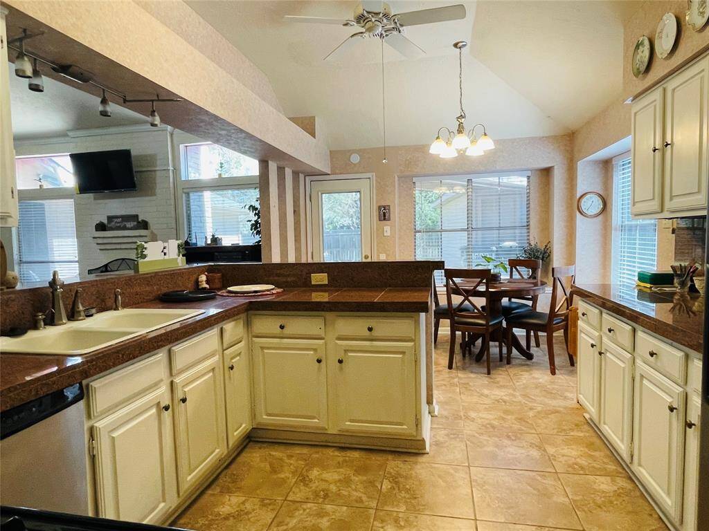 Kitchen with stainless steel applicances. Granite counter tops provide quick and easy preparation space.