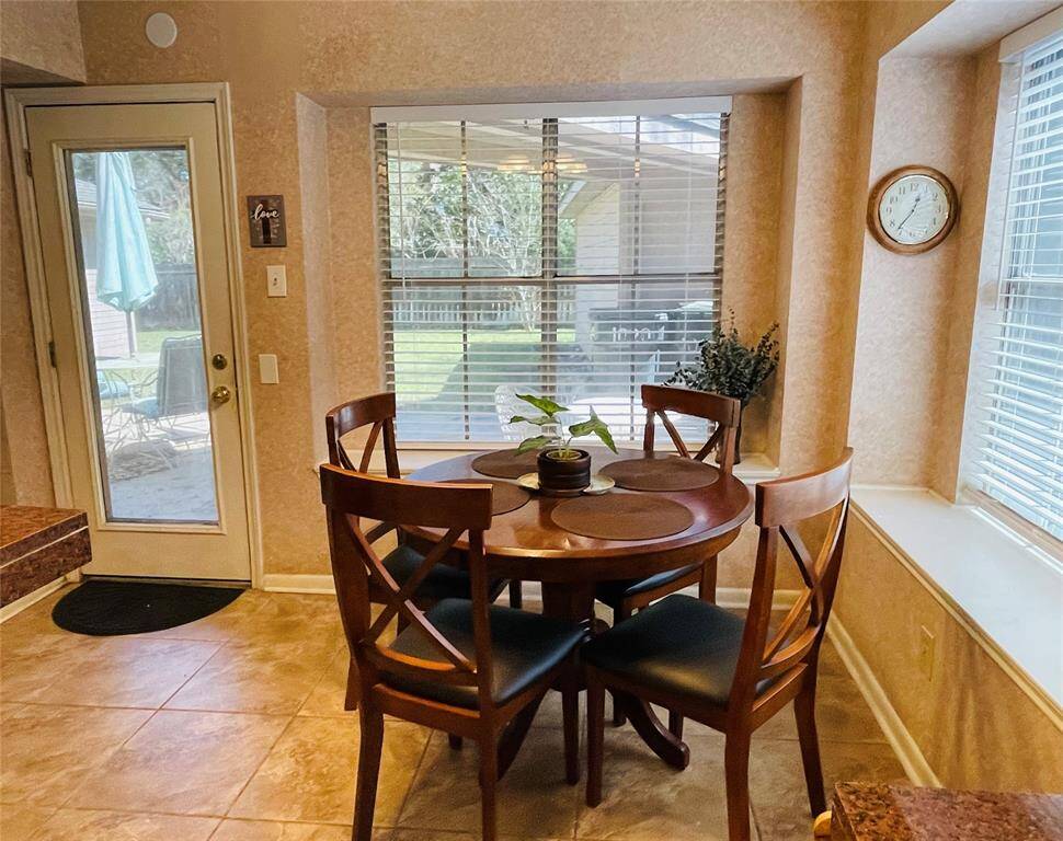 Breakfast room. Enjoy eating while looking outside to the fenced backyard.