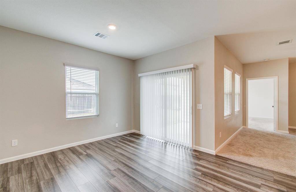 Breakfast room with entrance to backyard patio.