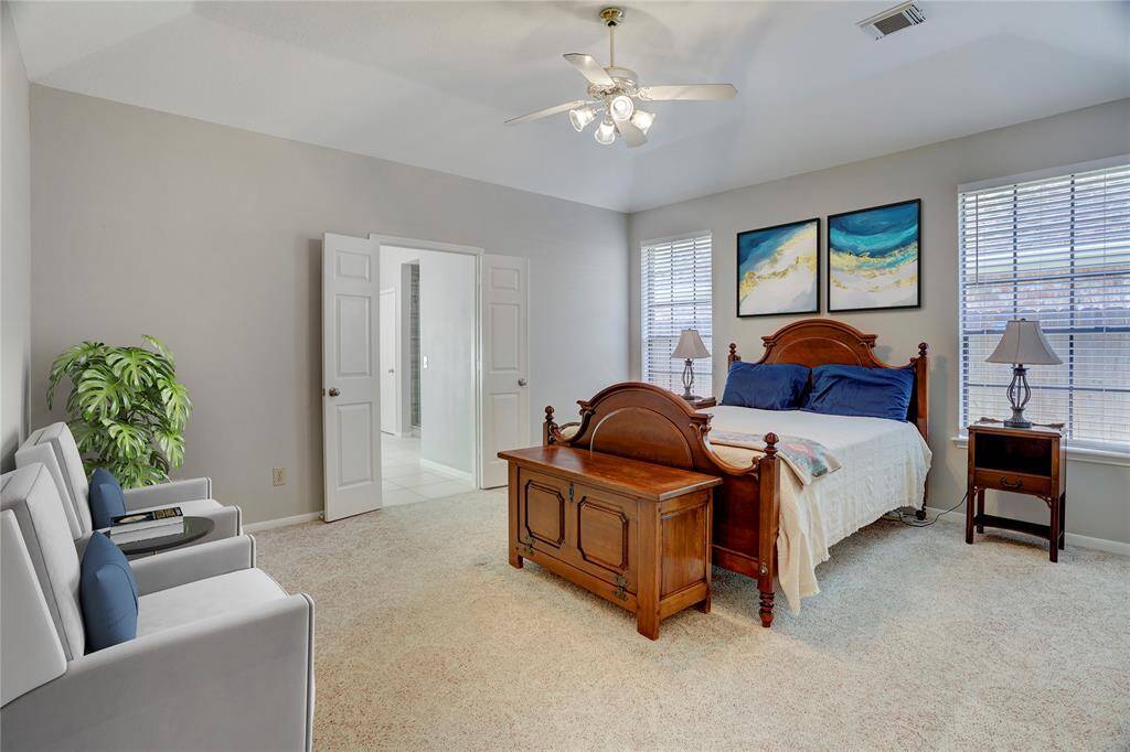 The primary suite is the perfect size for large bedroom furniture and a sitting area.