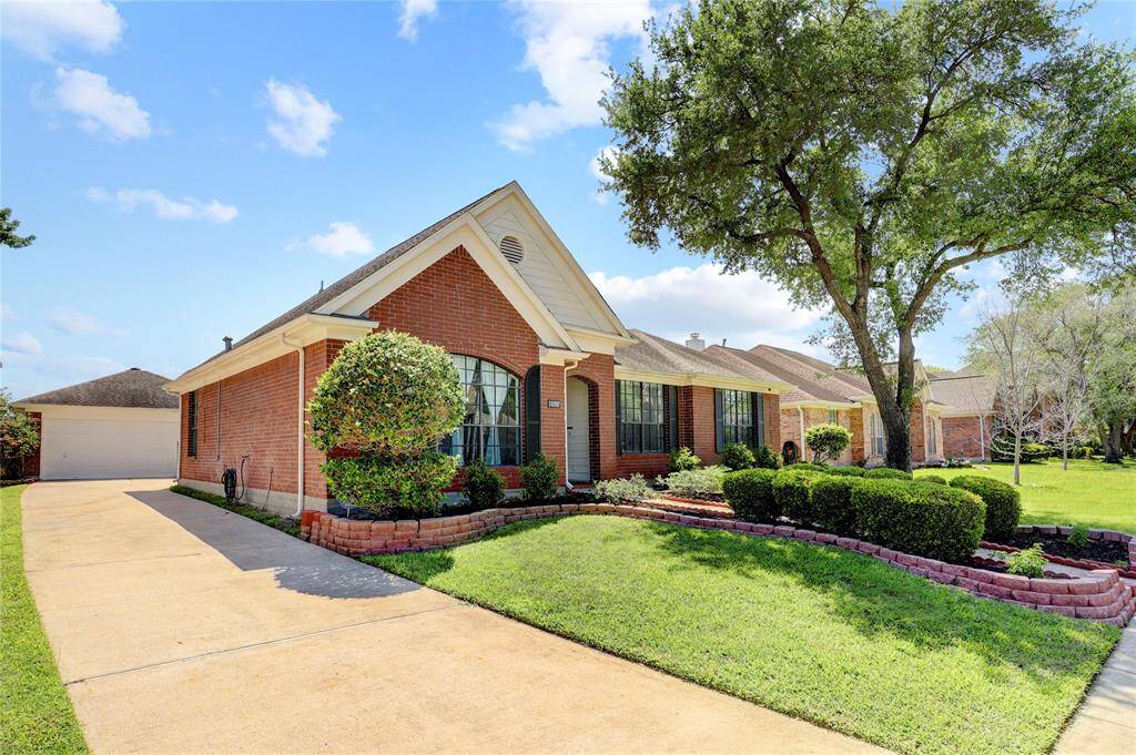 This beautiful home has an extra long driveway and detached, oversized garage.