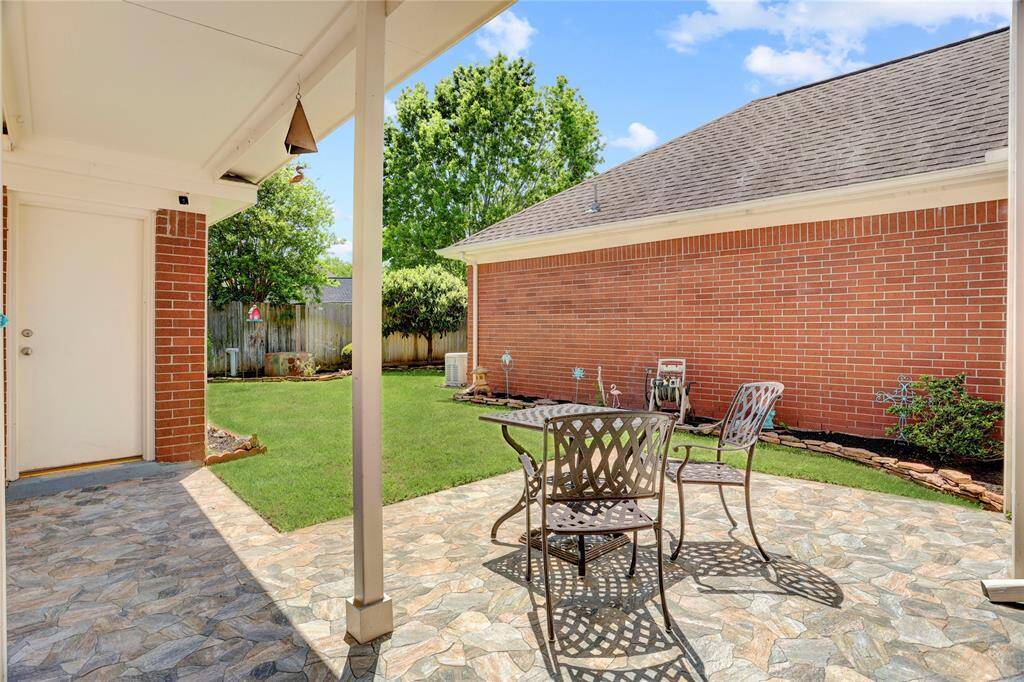 You have a lovely covered walkway to the detached garage.