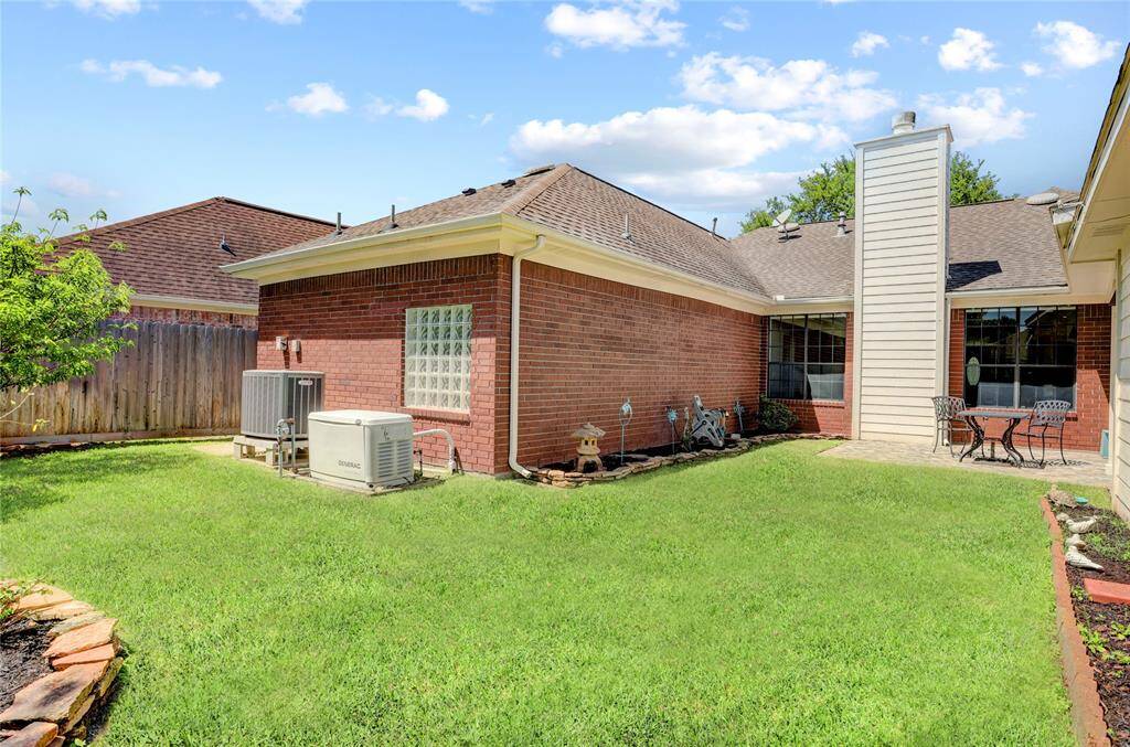 The beautifully maintained back yard is perfect for relaxing.