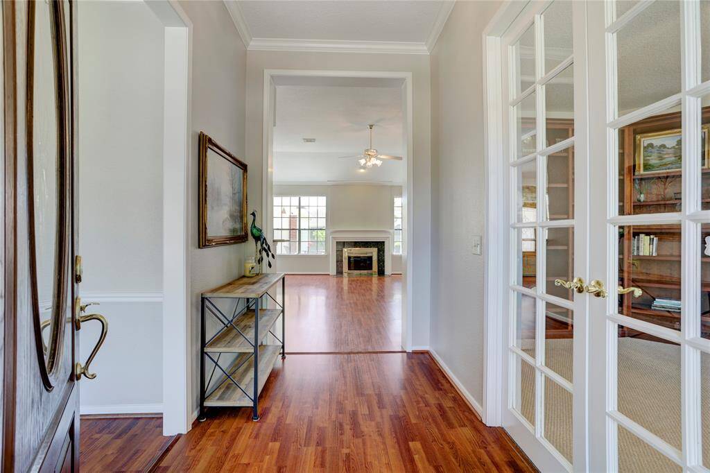 As you enter the home, you are greeted with a beautiful entryway and tall ceilings throughout!