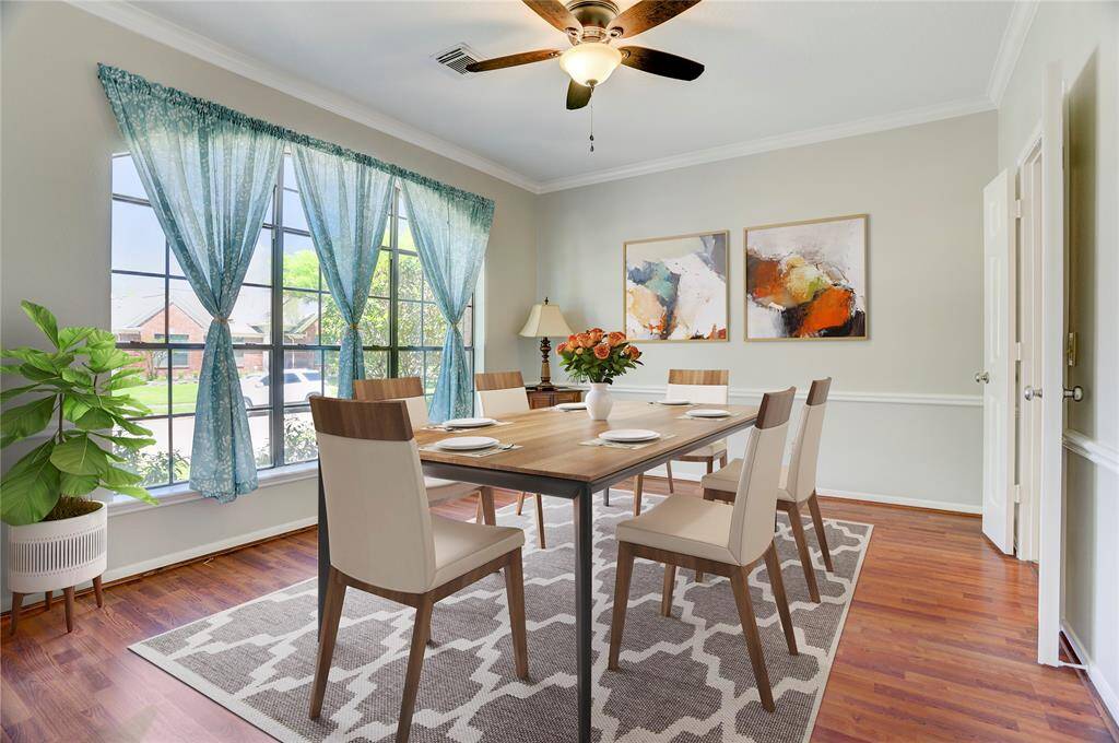 To the left of the front entry is the spacious dining room, with space for a table for 10 and so much natural light!