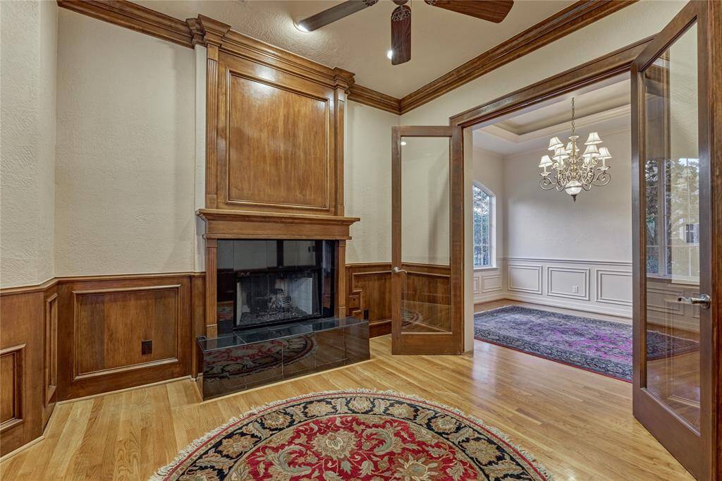 Elegant wood details create a warm, inviting atmosphere for any purpose you envision for this room.