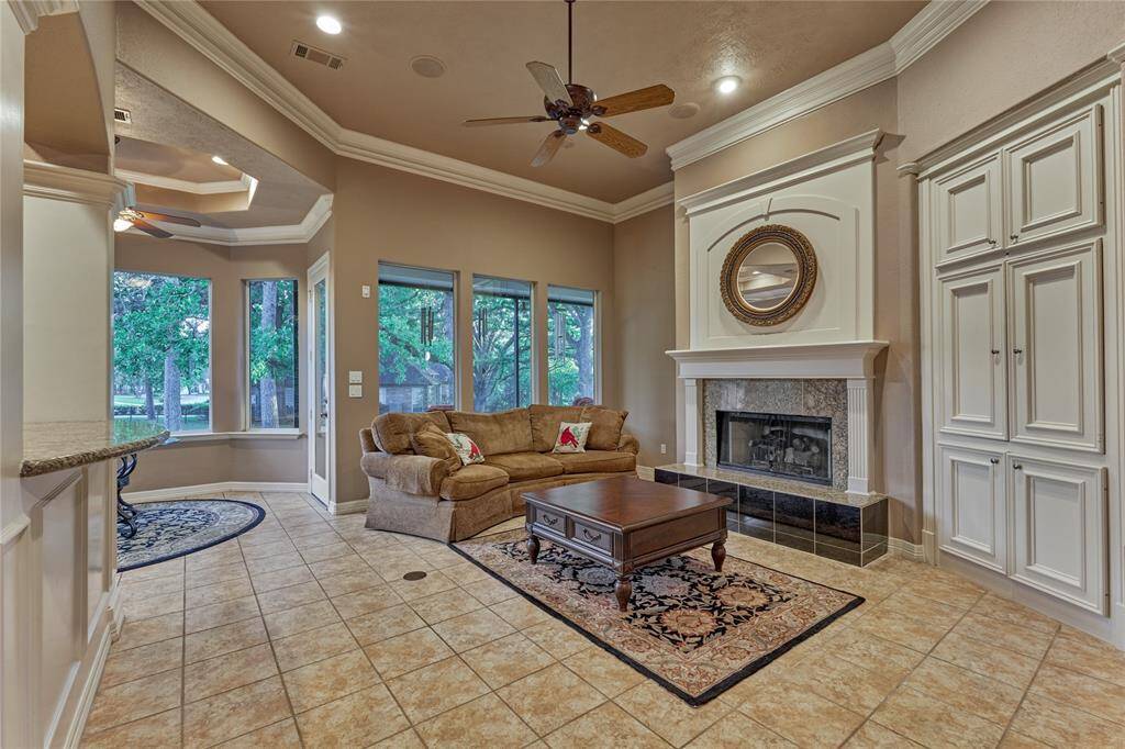Discover the family room's soaring ceilings, elegant millwork, and ample storage, perfect for comfortable living.