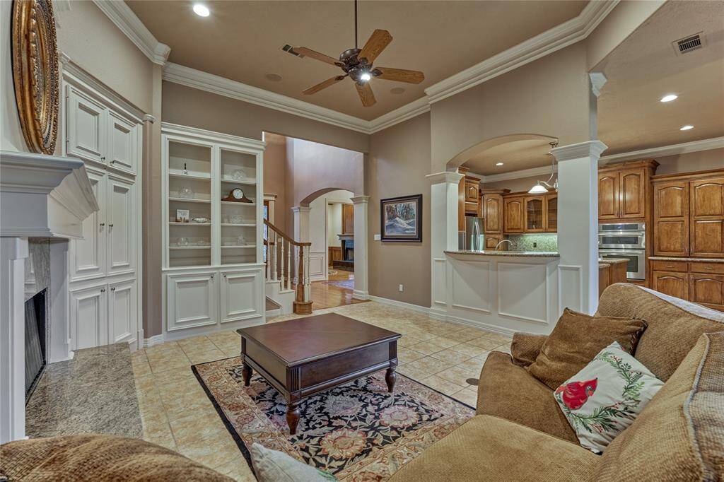 Elegant columns enhance the kitchen and family room, highlighting the inviting breakfast bar.