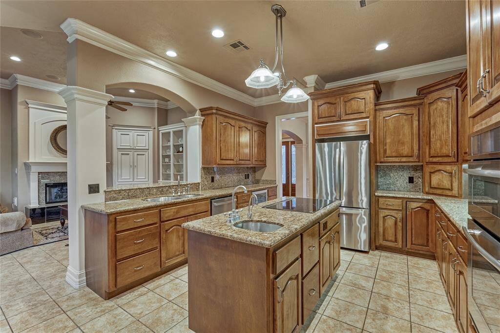 Cook gourmet meals effortlessly on the central island, complete with a convenient veggie prep sink.