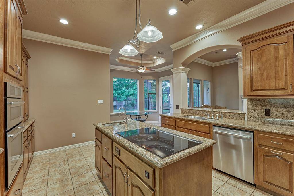 Elegant lighting enhances the center island.