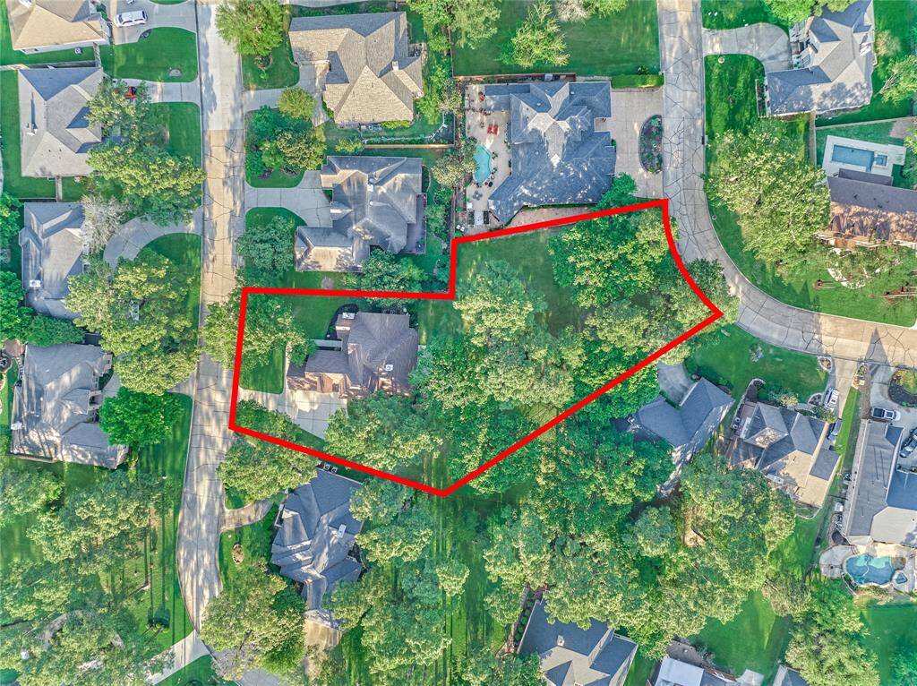 An aerial view showing the expansive backyard with it's park-like setting. So much room to enjoy the beautiful outdoors!
