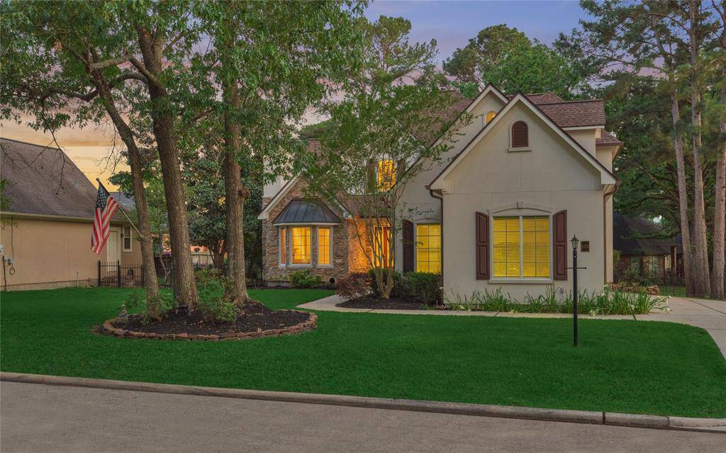 Charming 2,539sf home that is tucked into lush landscaping and mature shady trees.