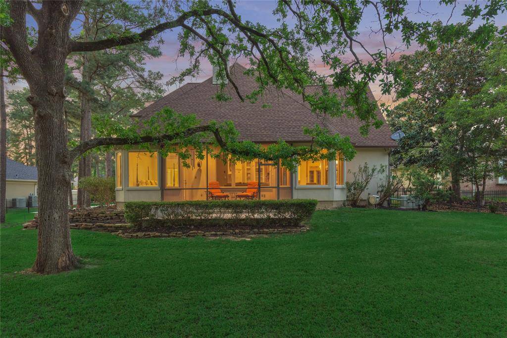 The screened-in patio is a lovely place to extend entertaining or to simply enjoy a quiet evening taking in the beauty of nature.