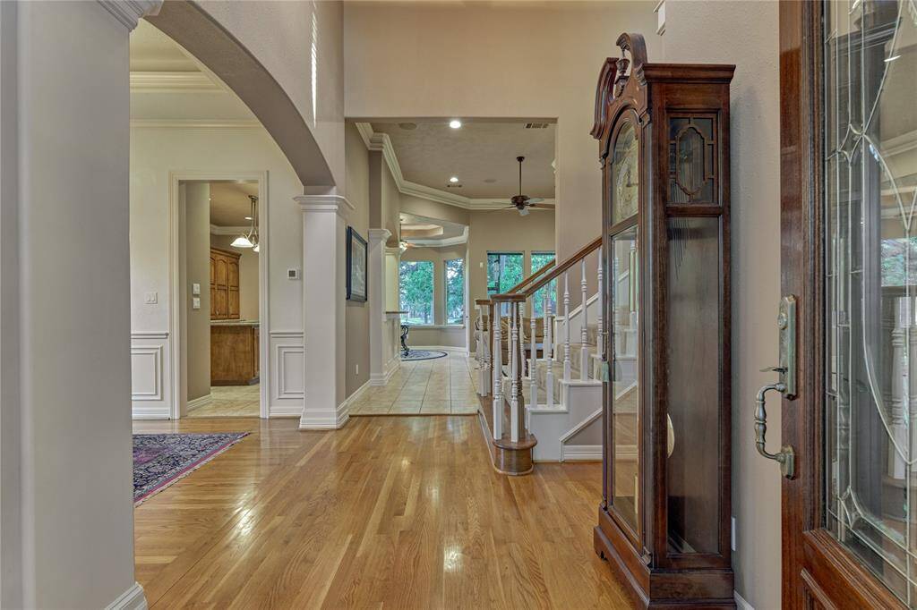 Upon entering you will notice the lovely rich wood flooring and double crown molding that adds an elegance to the lovely interior of this home.