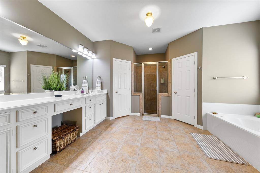 Primary bath with double sinks, Jetted tub and large separate shower. 2 separate closets.