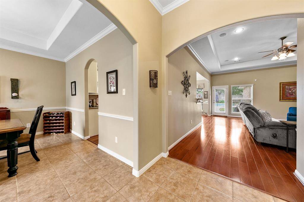 Arches, mouldings and tray ceilings showcase timeless elegance in this beautiful home.