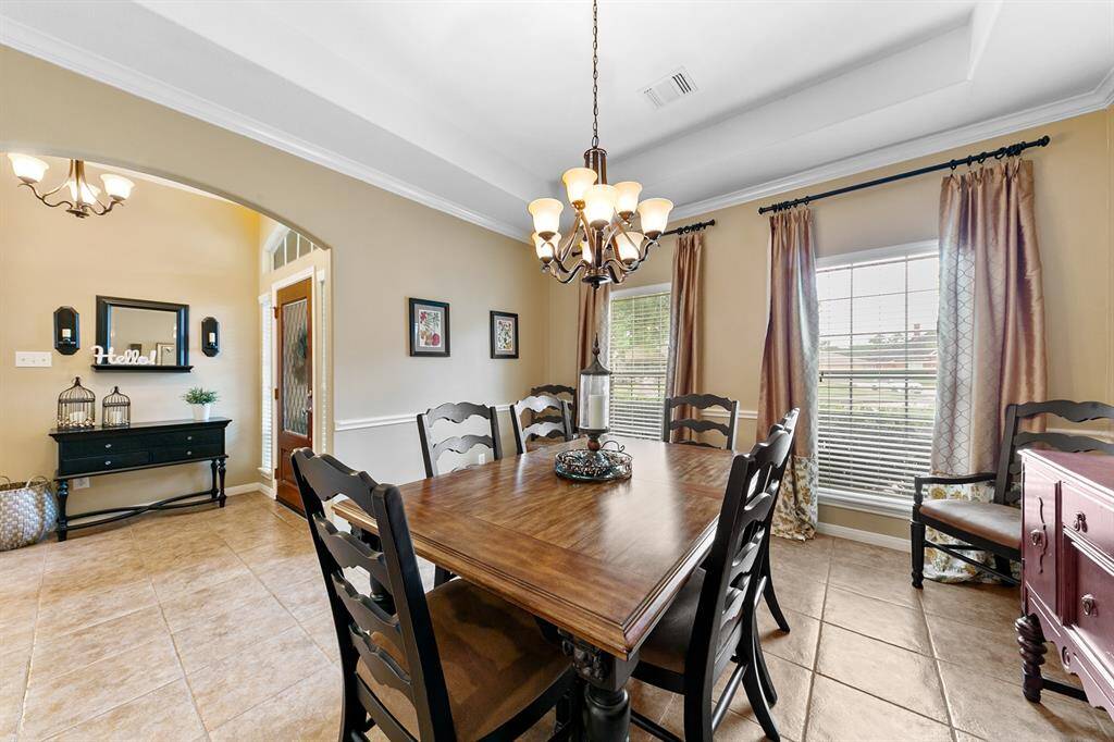 Spacious dining room provides ample space for large family gatherings.