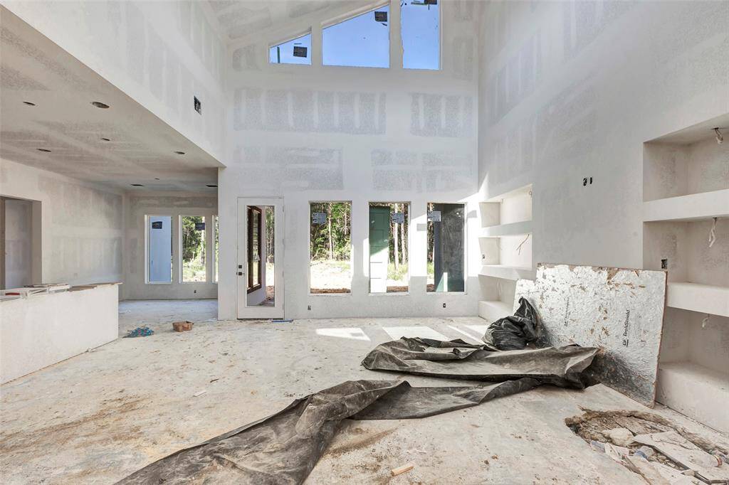Bright living area with vaulted ceilings.