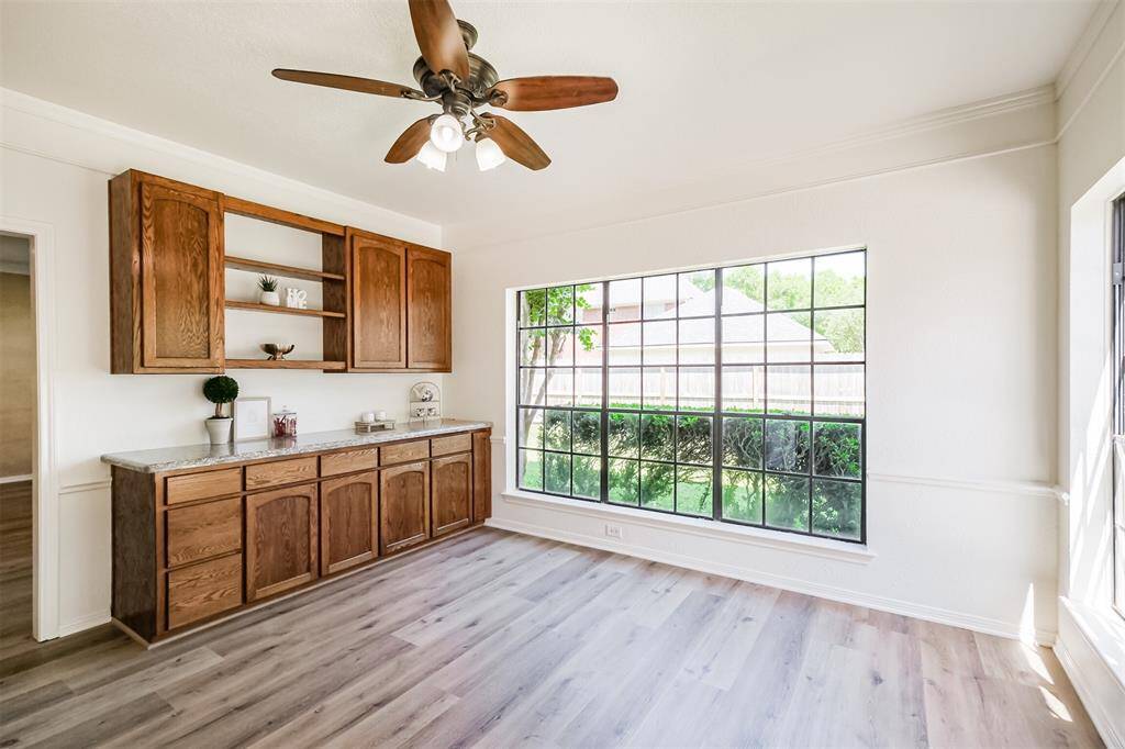Lovely breakfast/casual family dining area is light and bright with two large picture windows that give wonderful backyard vistas.