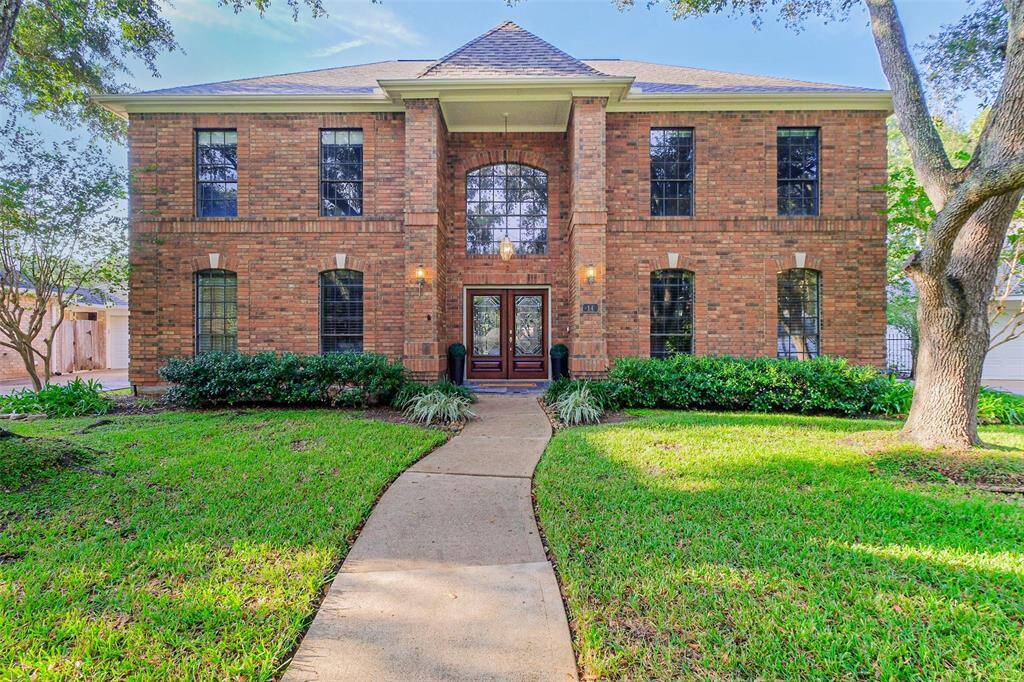 Beautiful symmetry in this lovely two story, 5 bedroom, Newmark home.