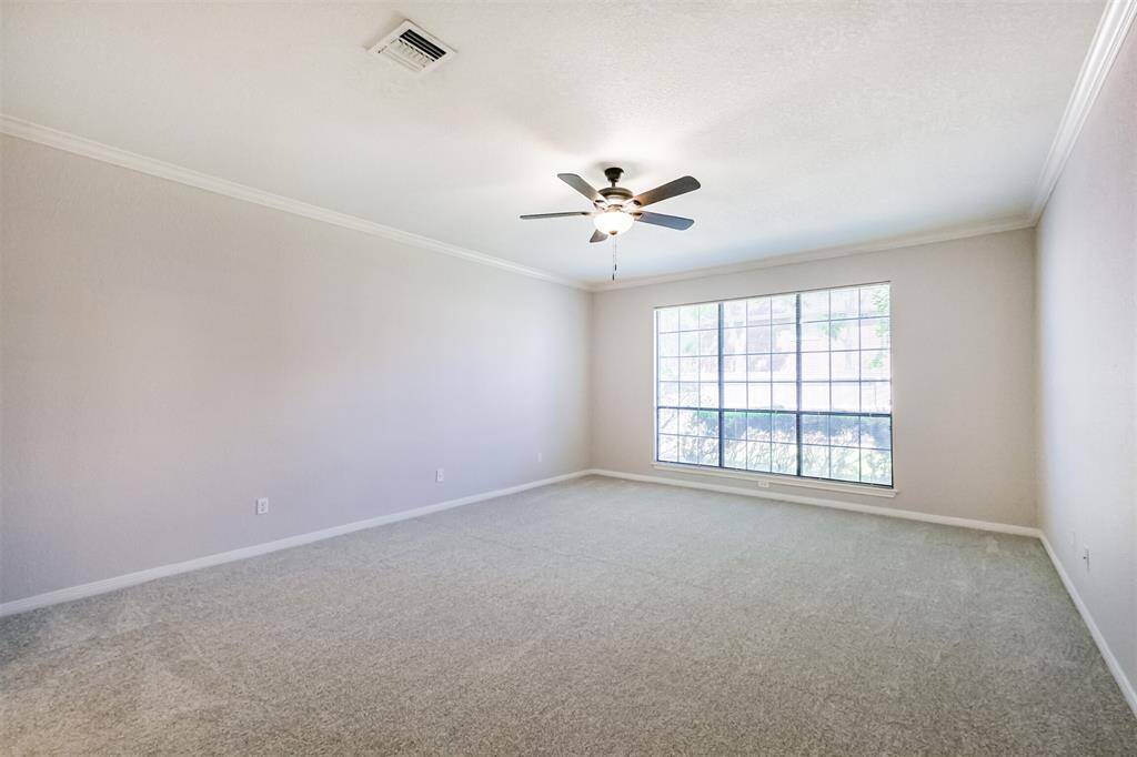 This spacious primary suite is located on the first floor and boasts fresh paint and new carpet.
