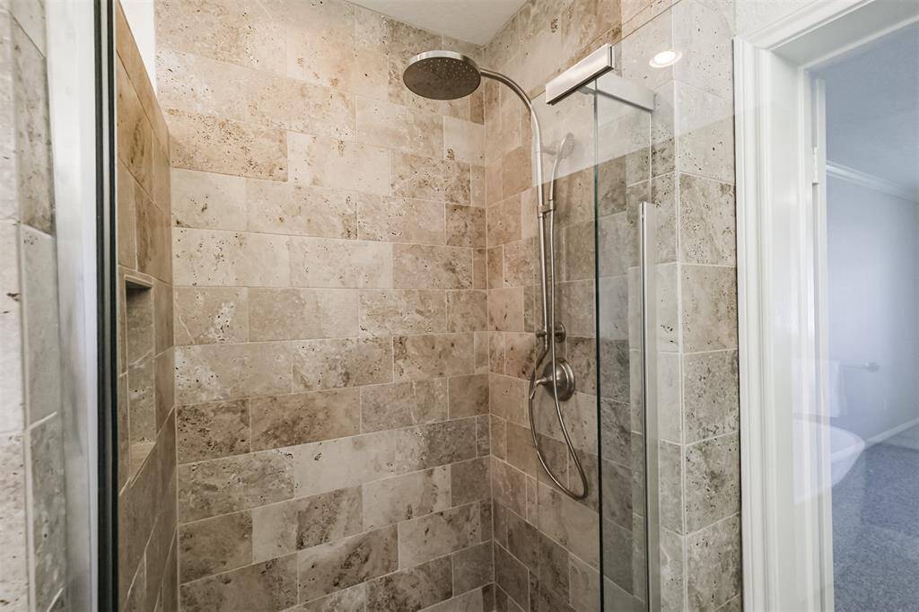 New walk in shower with glass door.