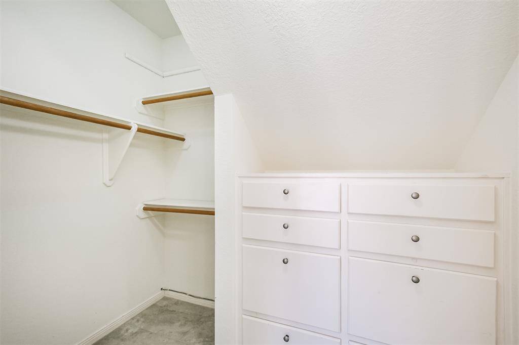 The second closet has hanging and drawer space.