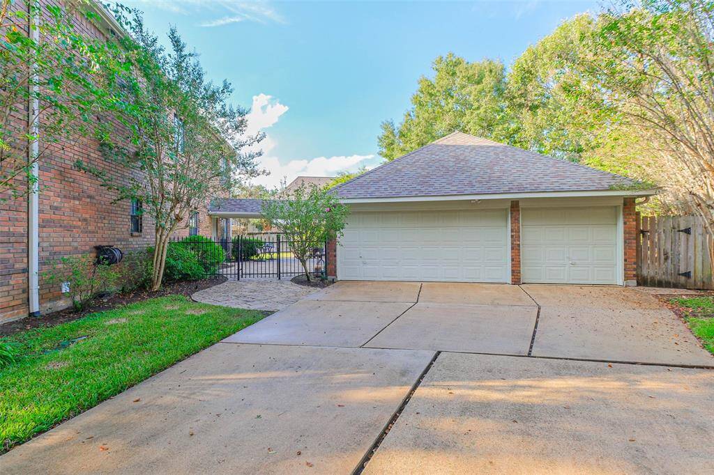 Large concrete area in front of the 3 car extended garage is perfect for basketball practice!